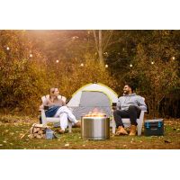 Napoleon Timberwolf Wood Fire Pit outside a tent with people