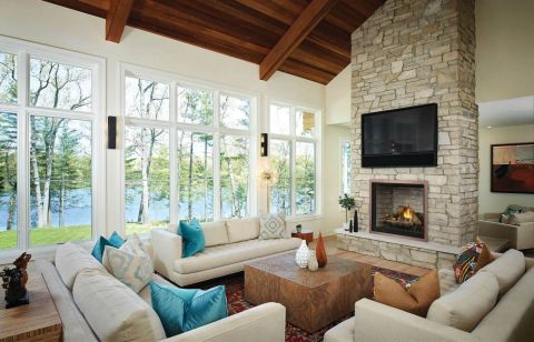 Fireplace in den with tv hung above