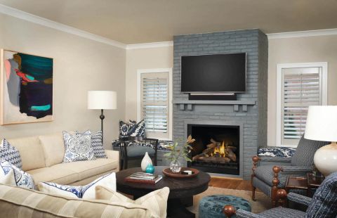 Fireplace in den with tv hung above