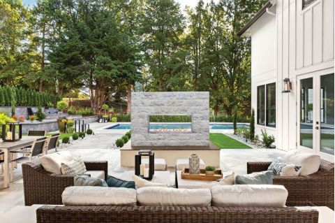 Galaxy 50-inch Outdoor Gas Fireplace by the pool showing see-thru option