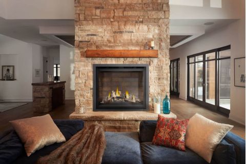Den with fireplace below tv